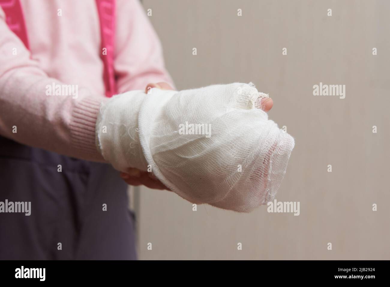 Children's hand in a medical plaster close-up Stock Photo