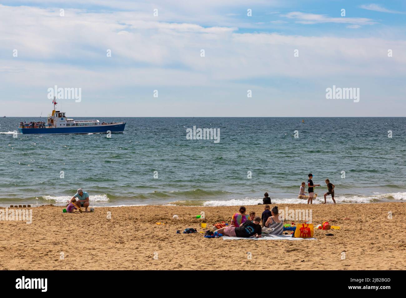 Bournemouth, Dorset UK. 2nd June 2022. UK weather: lovely warm and sunny as crowds flock to Bournemouth beaches to enjoy the sunshine at the seaside for the start of the long weekend to celebrate the Queens Platinum Jubilee. Credit: Carolyn Jenkins/Alamy Live News Stock Photo