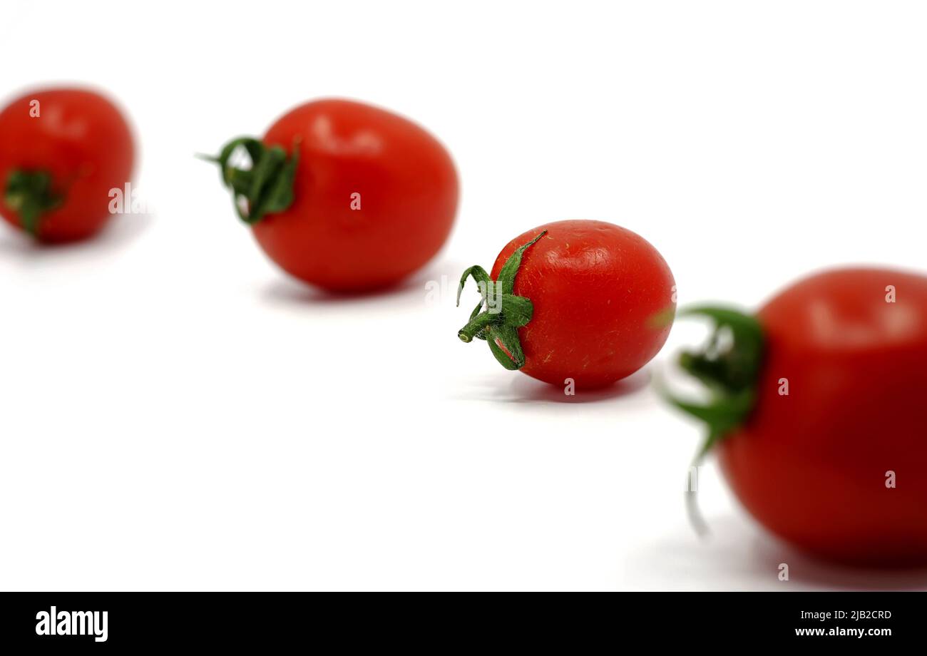 tomatoes isolated on a white background Stock Photo - Alamy