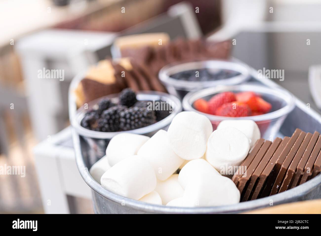 S'mores charcuterie board with fruits and starshaped graham crakers
