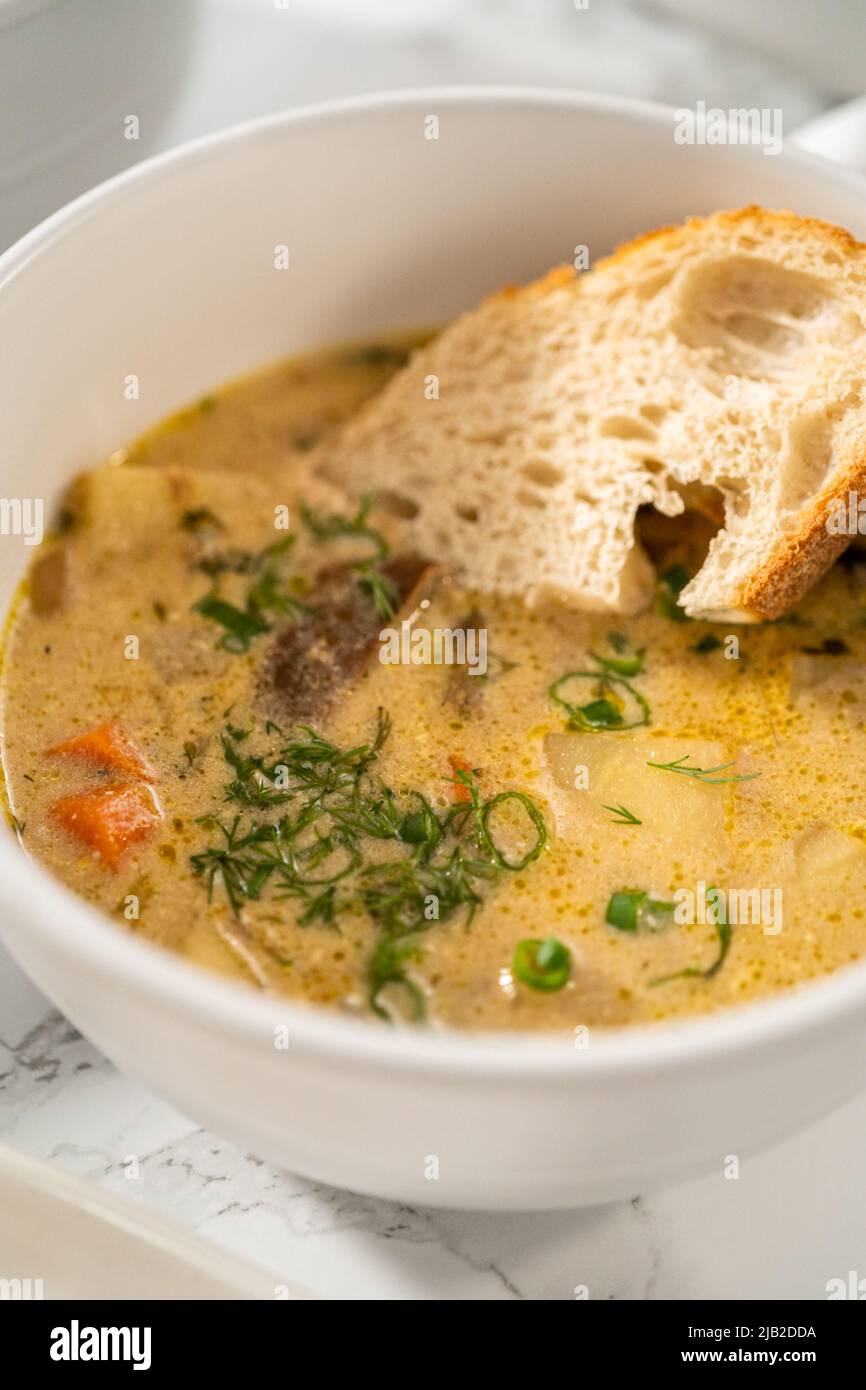 Serving creamy wild mushroom soup made out of dehydrated wild mushrooms