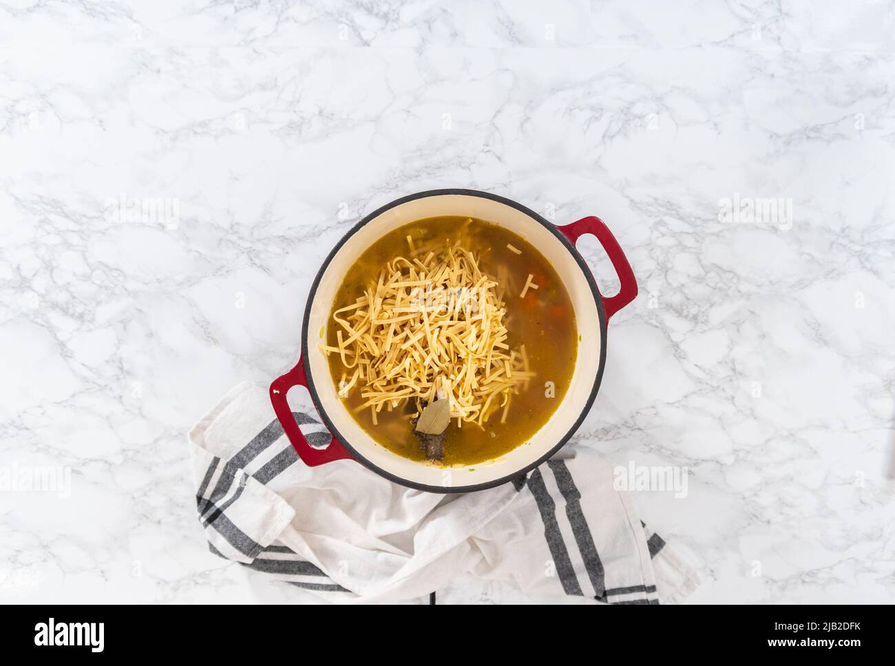 Flat lay. Cooking chicken noodle soup with kluski noodles in an