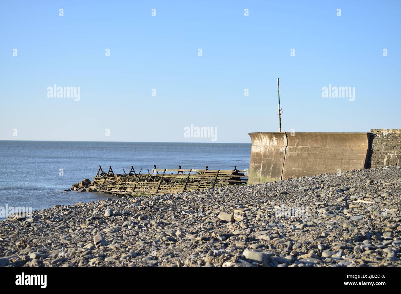 Harbour wall at Aberaeron beach, Wales, UK Stock Photo