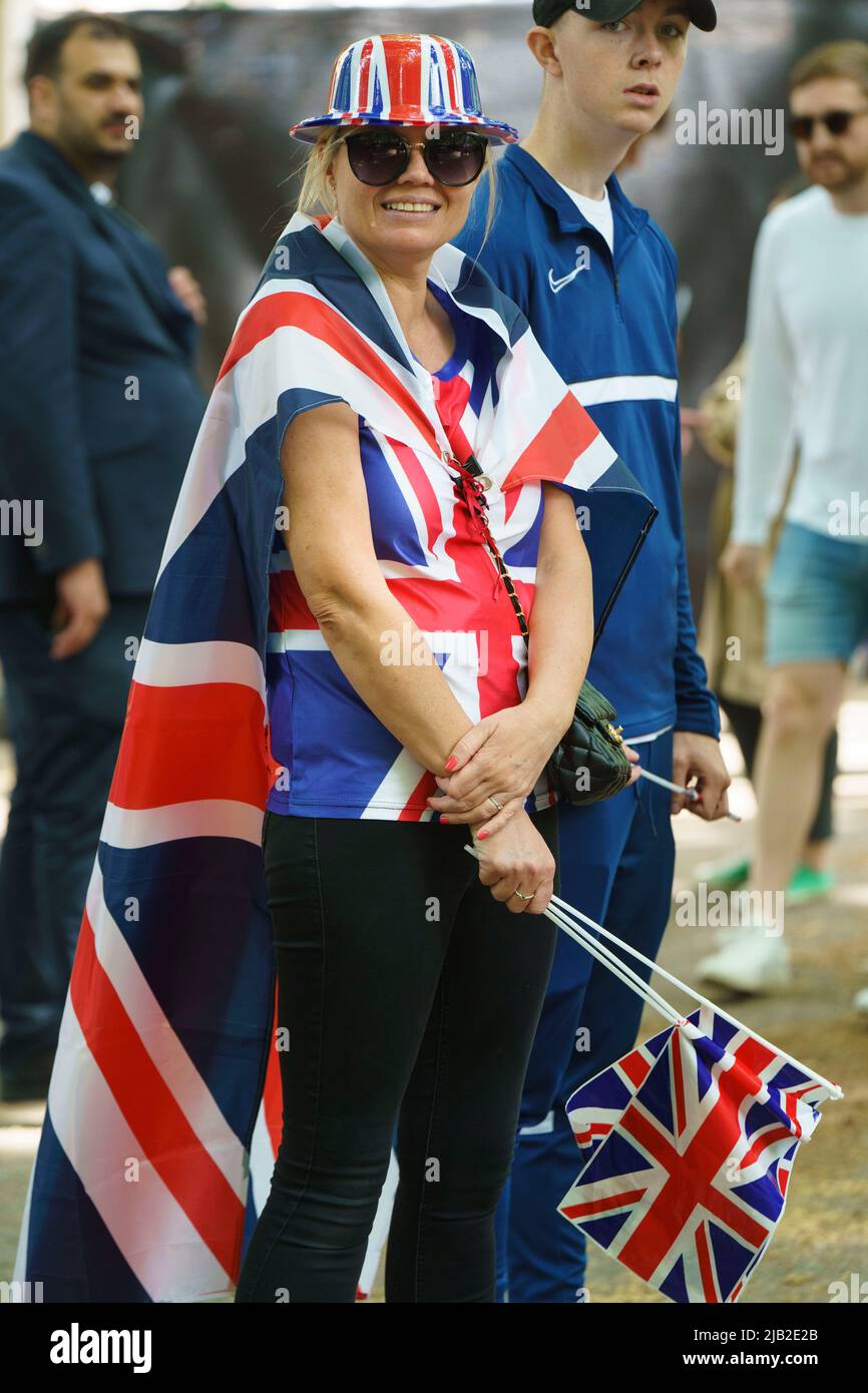 LONDON - JUNE 2: A woman in Union Jack regalia, watches the Trooping the Colour ceremony on June 2, 2022 in central London. Credit: David Levenson/Alamy Live News Stock Photo