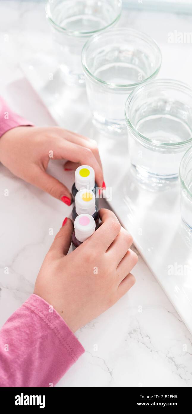 Easter egg coloring. Mixing food coloring with water and a dash of