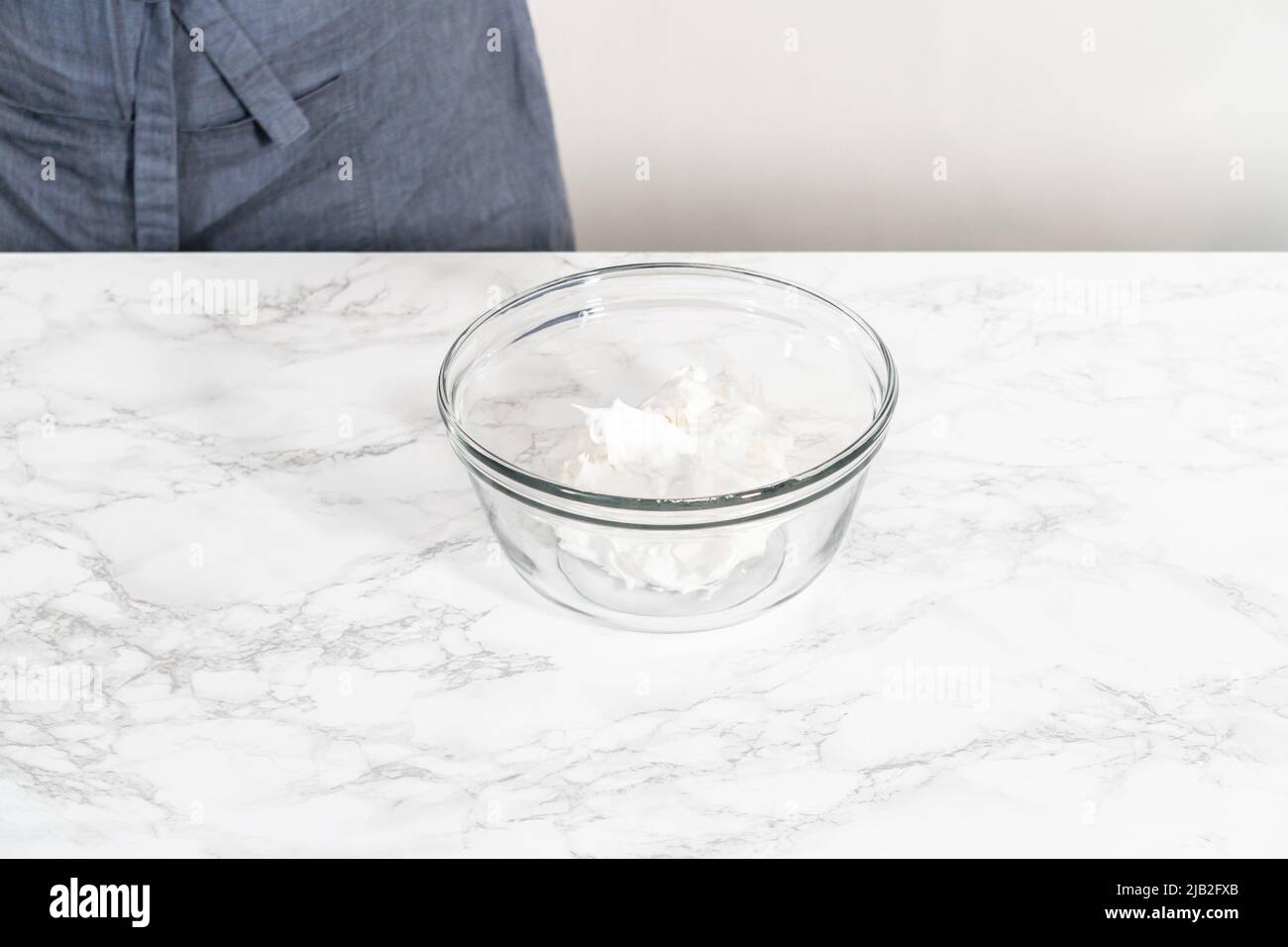 Mixing food coloring into the meringue to bake meringue cookies Stock