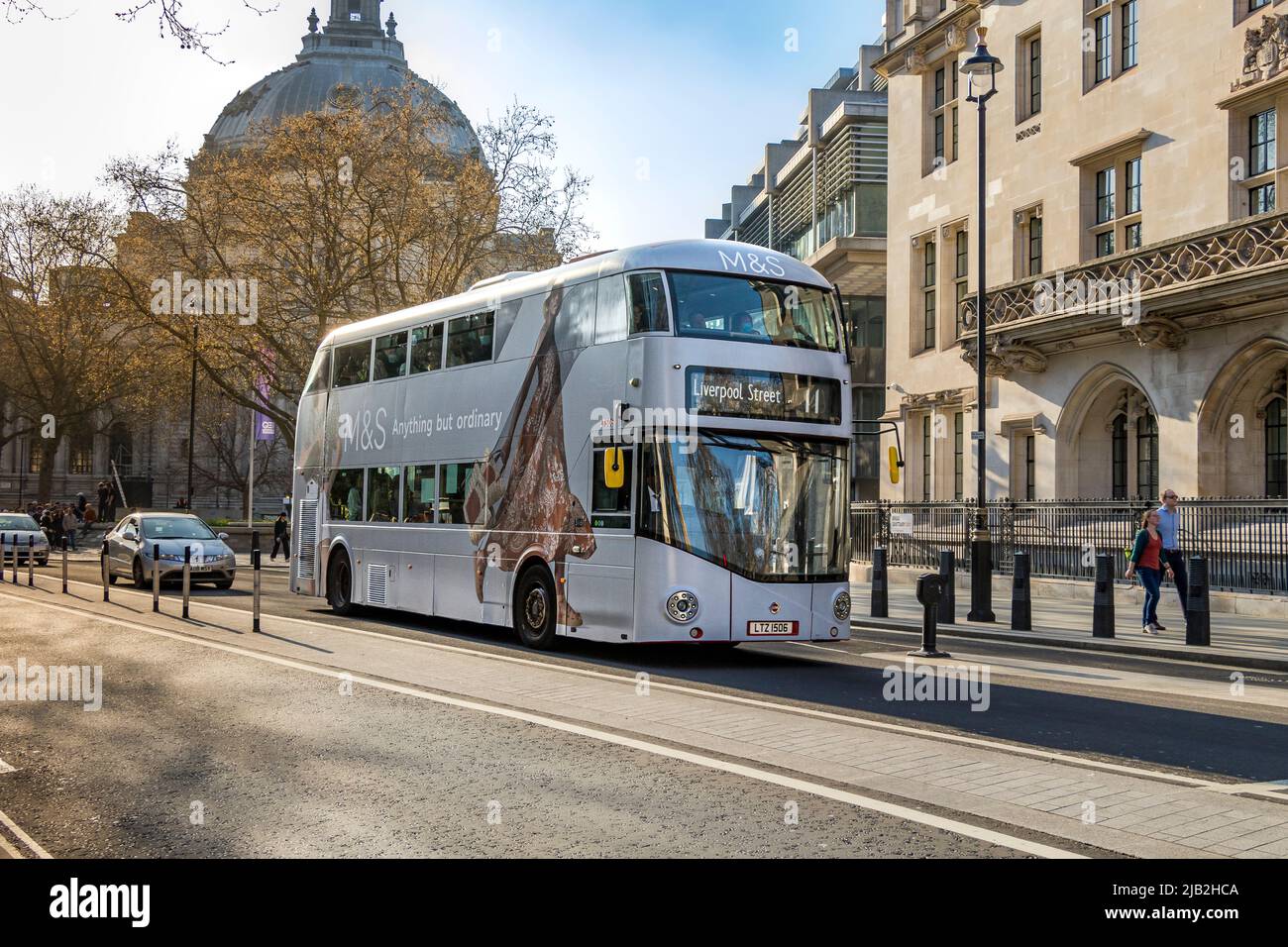 London bus route 11 at Broad Sanctuary, Westminster in Marks and Spenser advertising wrap , London ,UK Stock Photo