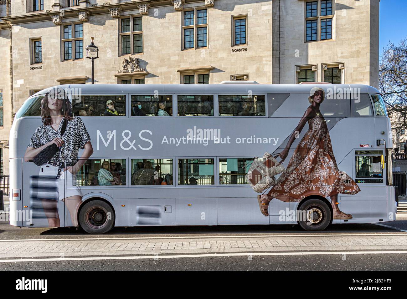 London bus route 11 at Broad Sanctuary, Westminster in Marks and Spenser advertising wrap , London ,UK Stock Photo