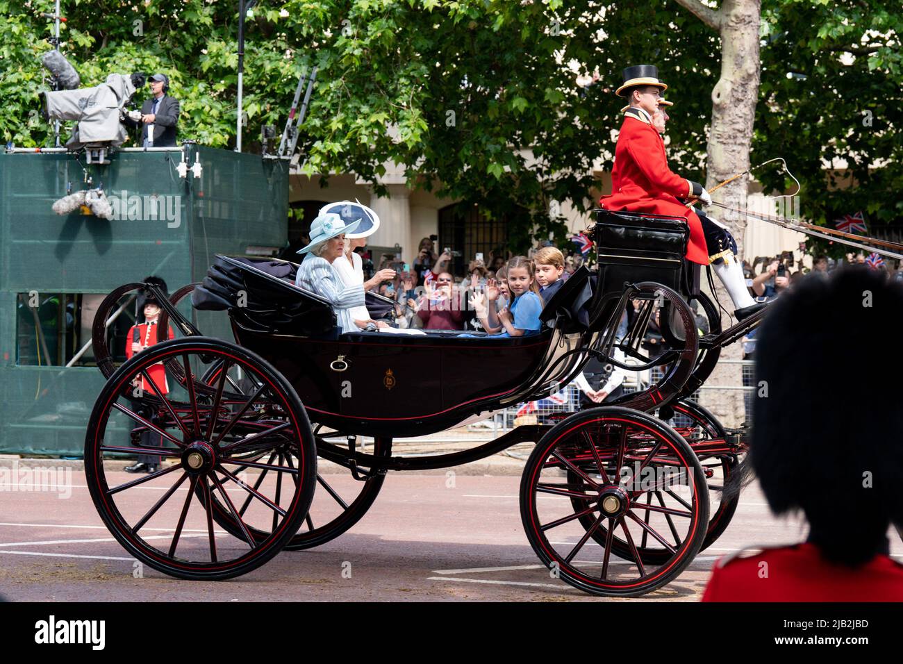 London, UK. 24th May, 2022. Camilla Duchess of Cornwall, Katherine Duchess of Cambridge, George, Charlotte and Louis travel down the mall in a horse drawn carage to celebrate the Platinum Jubilee of Queen Elizabeth 11 in London, United Kingdom on 5/24/2022. (Photo by Richard Washbrooke/News Images/Sipa USA) Credit: Sipa USA/Alamy Live News Stock Photo