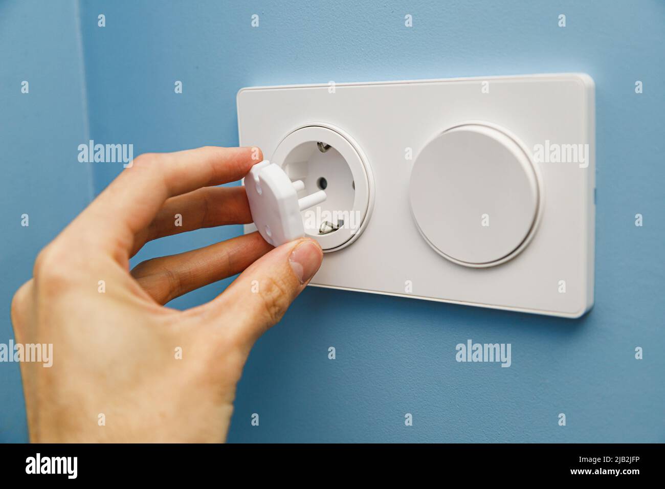 Children's electrical safety. Safety plug for an electrical outlet