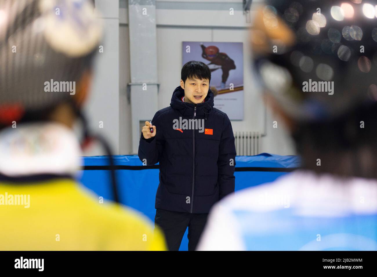 (220602) -- QITAIHE, June 2, 2022 (Xinhua) -- Zhang Lizeng, coach of Qitaihe Juvenile's Short-Track Speed Skating Amateur Sports School guides young athletes during a training session at Qitaihe Sports Center in Qitaihe City, northeast China's Heilongjiang Province, May 30, 2022. Qitaihe City in Heilongjiang Province, famed for its short-track speed skating talents, has trained 10 world champions including Yang Yang, Wang Meng and Fan Kexin. Generations of coachs in the city have endeavored to discover and train young talents for short-track speed skating. (Xinhua/Xie Jianfei) Stock Photo