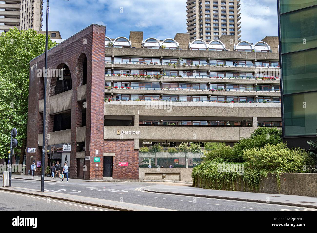 Flowers adorn the terraces of one of the terrace blocks of the Barbican Estate in The City Of London , EC2 Stock Photo