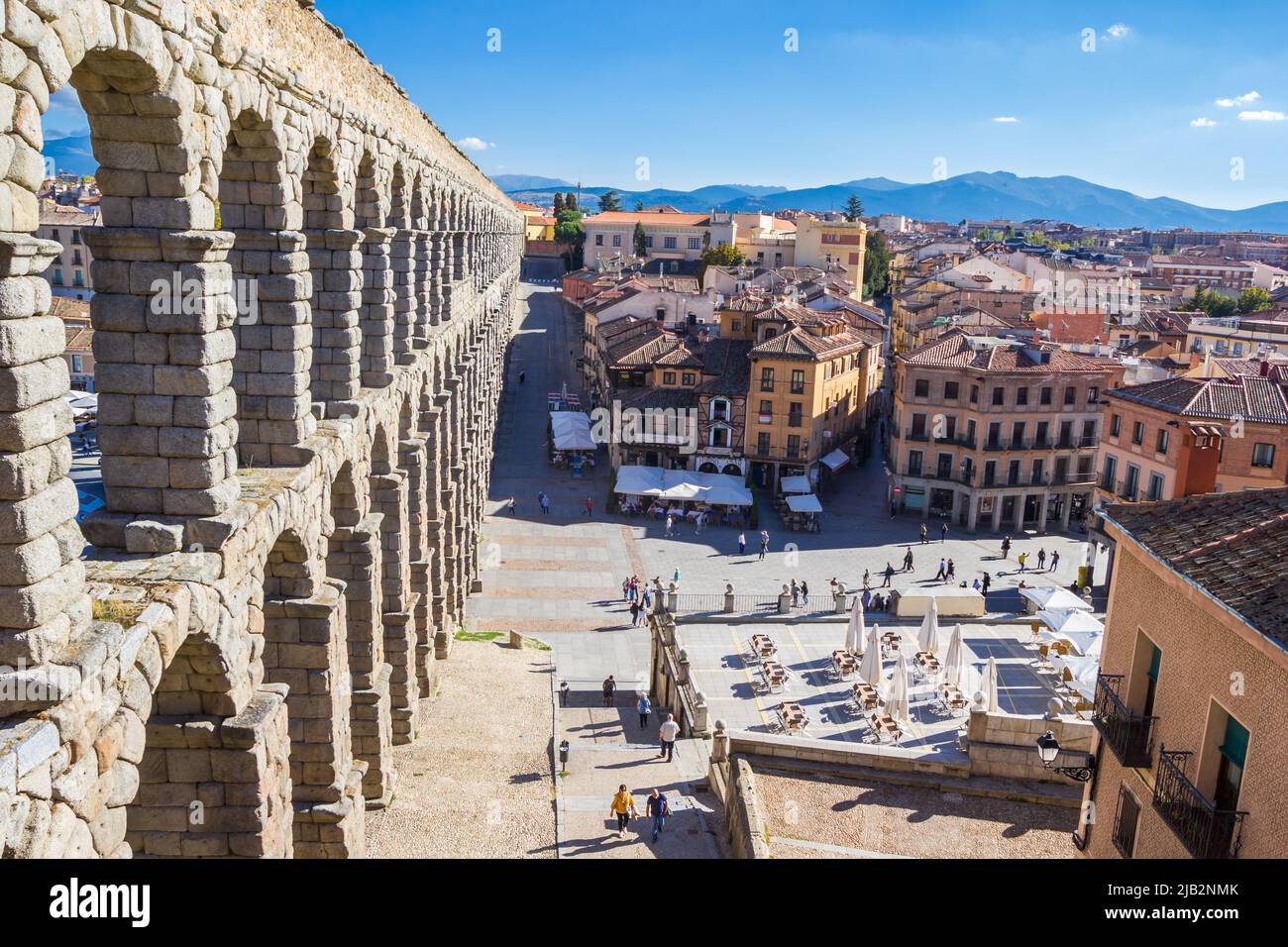 Restaurants at the roman aqueduct in Segovia, Spain Stock Photo