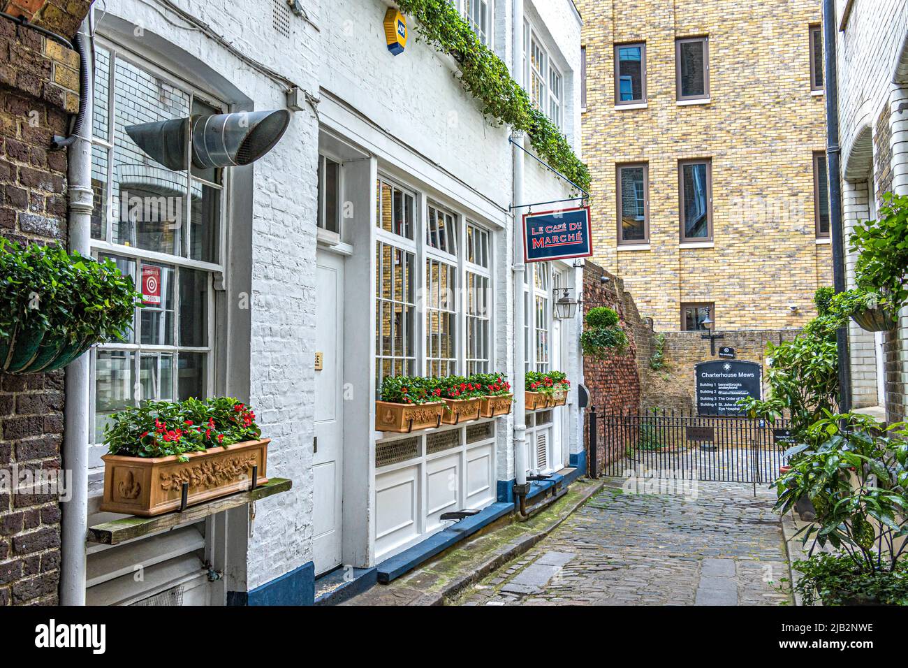 Le Cafe du Marche ,a French restaurant tucked away down a cobbled mews on the corner of historic Charterhouse Square , London EC1 Stock Photo