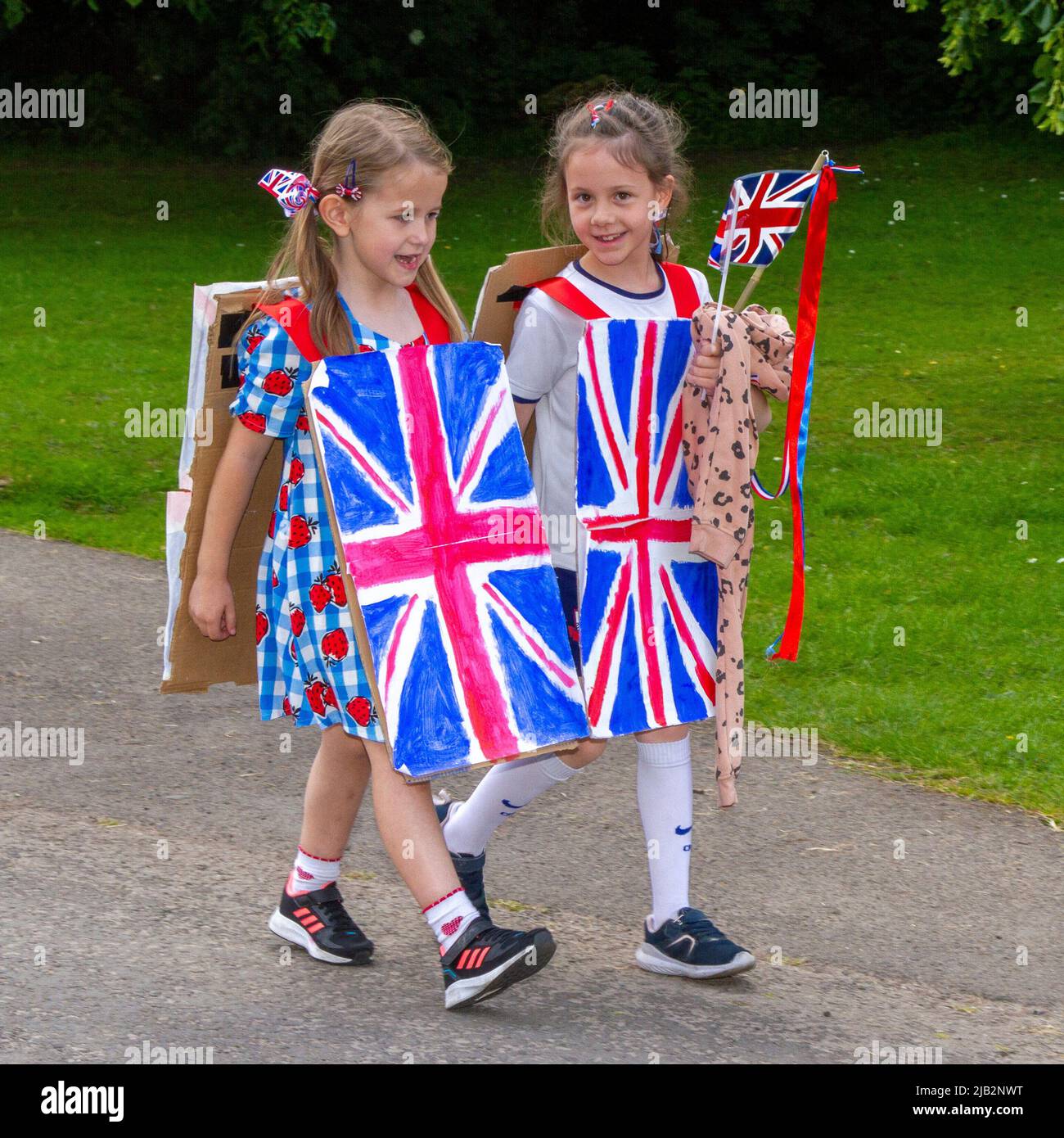 Leyland, Lancashire. UK Events, 2 June 2022.  Lilly and Gail at the Queens Jubilee event Festival parade in Worden Park. 3 days of music, fun, enjoyment, and celebration coincide with the Queen’s Platinum Jubilee weekend.  Credit; MediaWorldImages/ AlamyLiveNews/ Stock Photo