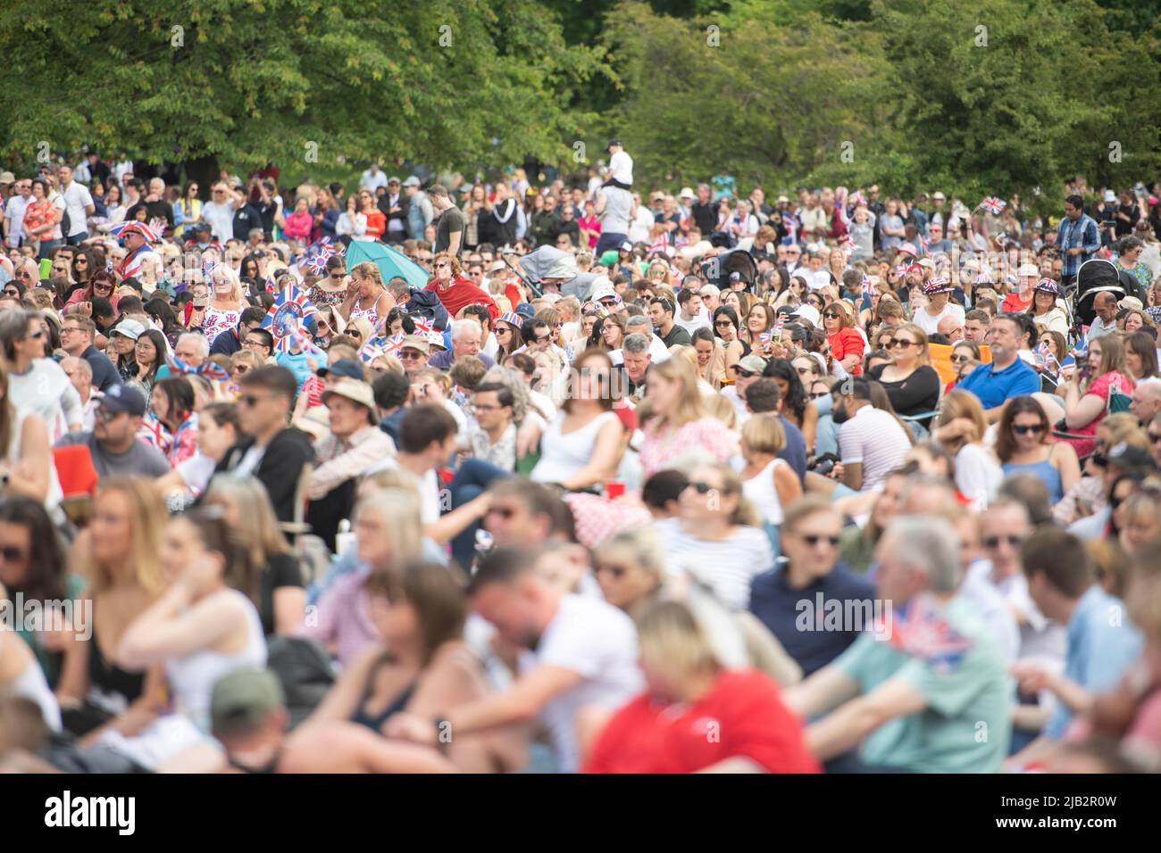 London, UK. 2 June 2022. Crowds watch Trooping the Colour on St James Park. Today is Queen Elizabeth II Platinum Jubilee. Credit: Benjamin Wareing/ Alamy Live News Stock Photo