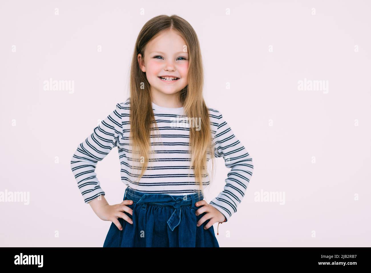 Adorable smiling little girl in dress isolated on a white Stock Photo ...