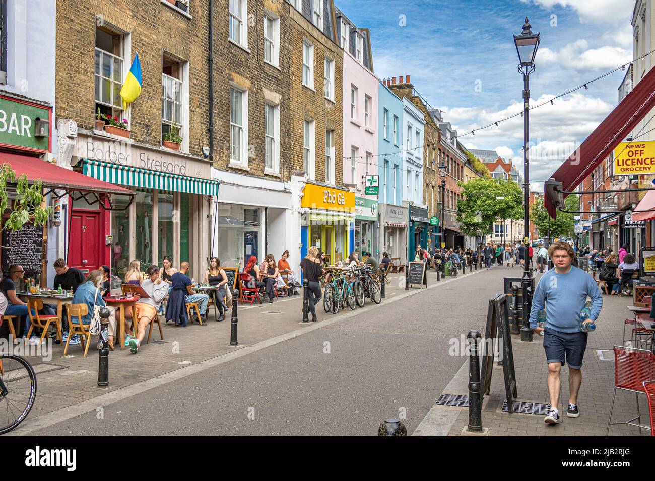 People outside on a summers day along Exmouth Market, Clerkenwell ,London EC1 Stock Photo