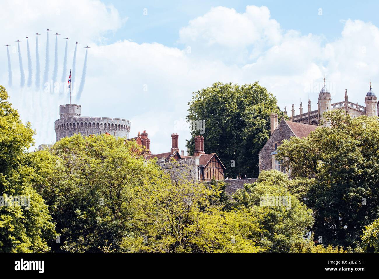 Windsor, UK. 2nd June, 2022. The Red Arrows pass over Windsor Castle