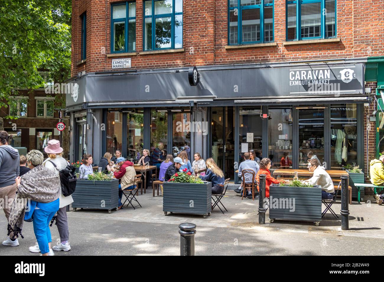 People sitting outside Caravan a coffee shop,  restaurant and bar located on Exmouth Market, Clerkenwell ,London EC1 Stock Photo