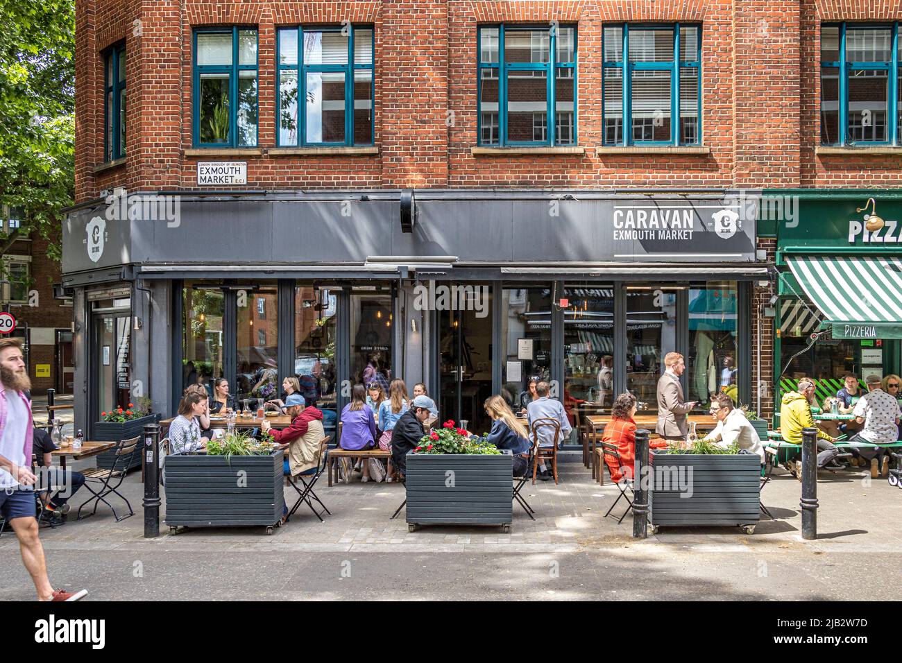People sitting outside Caravan a coffee shop,  restaurant and bar located on Exmouth Market, Clerkenwell ,London EC1 Stock Photo