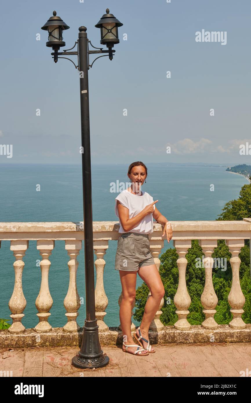 one girl stands on the embankment in Batumi Stock Photo - Alamy