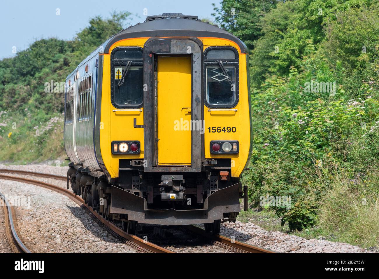 Class 156 156490 approaches Hawthorn Dene viaduct on the Durham Coast Line south of Seaham, County Durham, UK Stock Photo