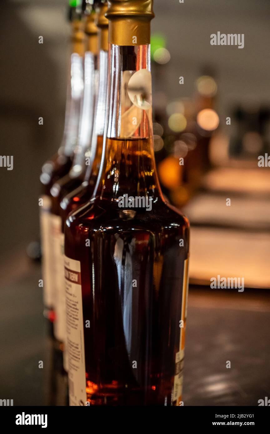 Different ages and colours of strong alcoholic apple drink calvados in