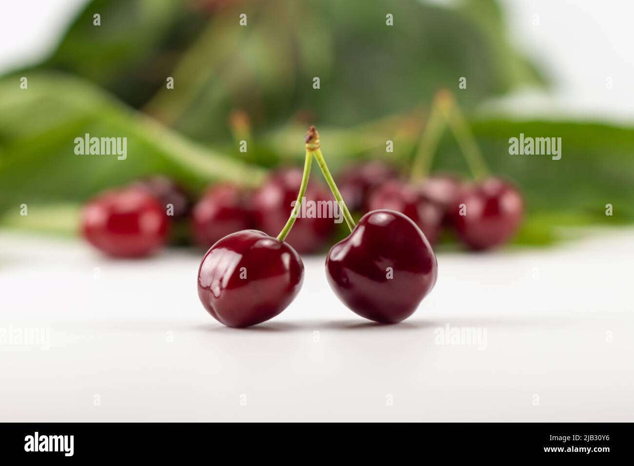 Sweet cherry berries isolated on white background. Selective focus. Stock Photo