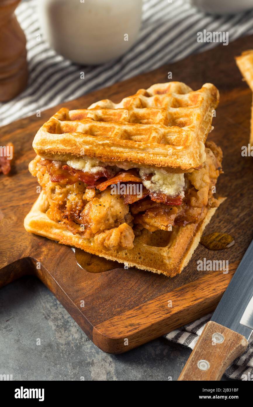 Homemade Chicken and Waffle Sandwich with Bacon and Syrup Stock Photo