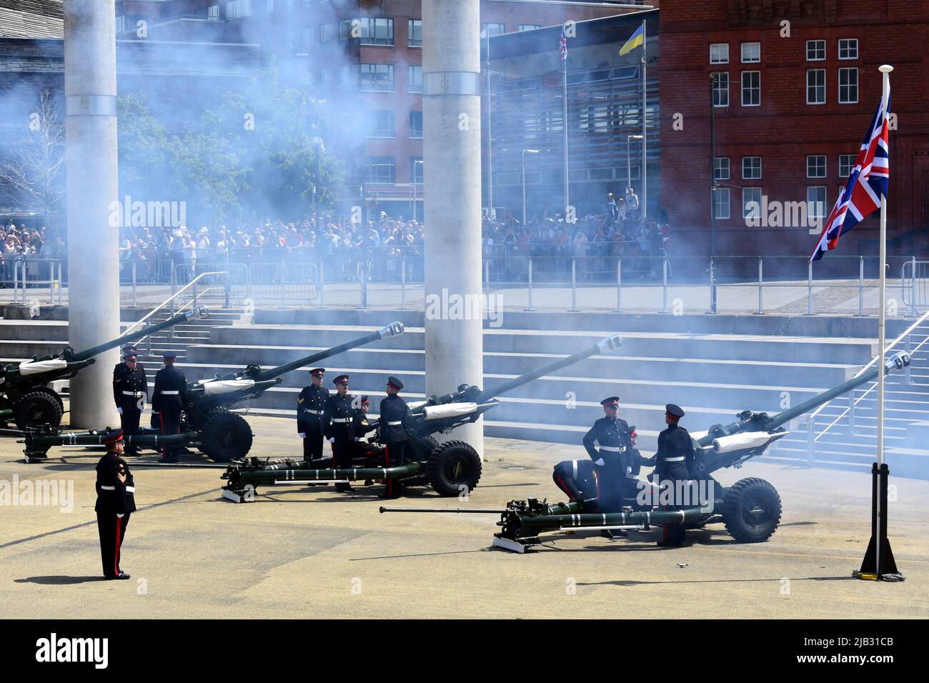 Reservists from 104 Regiment Royal Artillery perform the 42 gun salute for the Queen's Platinum Jubilee at Roald Dahl Plass, Cardiff Bay, Wales Stock Photo