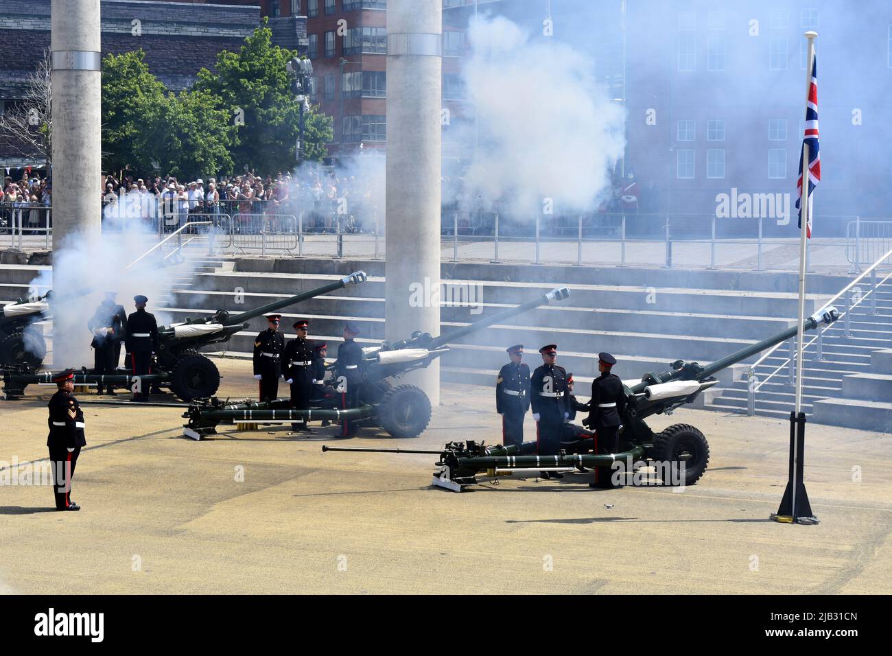 Reservists from 104 Regiment Royal Artillery perform the 42 gun salute for the Queen's Platinum Jubilee at Roald Dahl Plass, Cardiff Bay, Wales Stock Photo