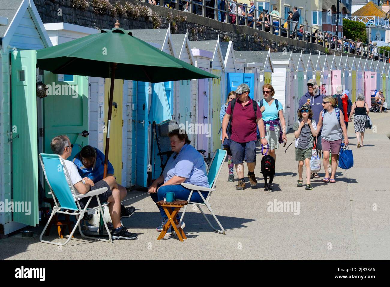 Lyme Regis, Dorset, UK.  2nd June 2022.  UK Weather.  The seafront is busy with holidaymakers enjoying the scorching hot afternoon sunshine at the seaside resort of Lyme Regis in Dorset during the Platinum Jubilee bank holiday.  Picture Credit: Graham Hunt/Alamy Live News Stock Photo