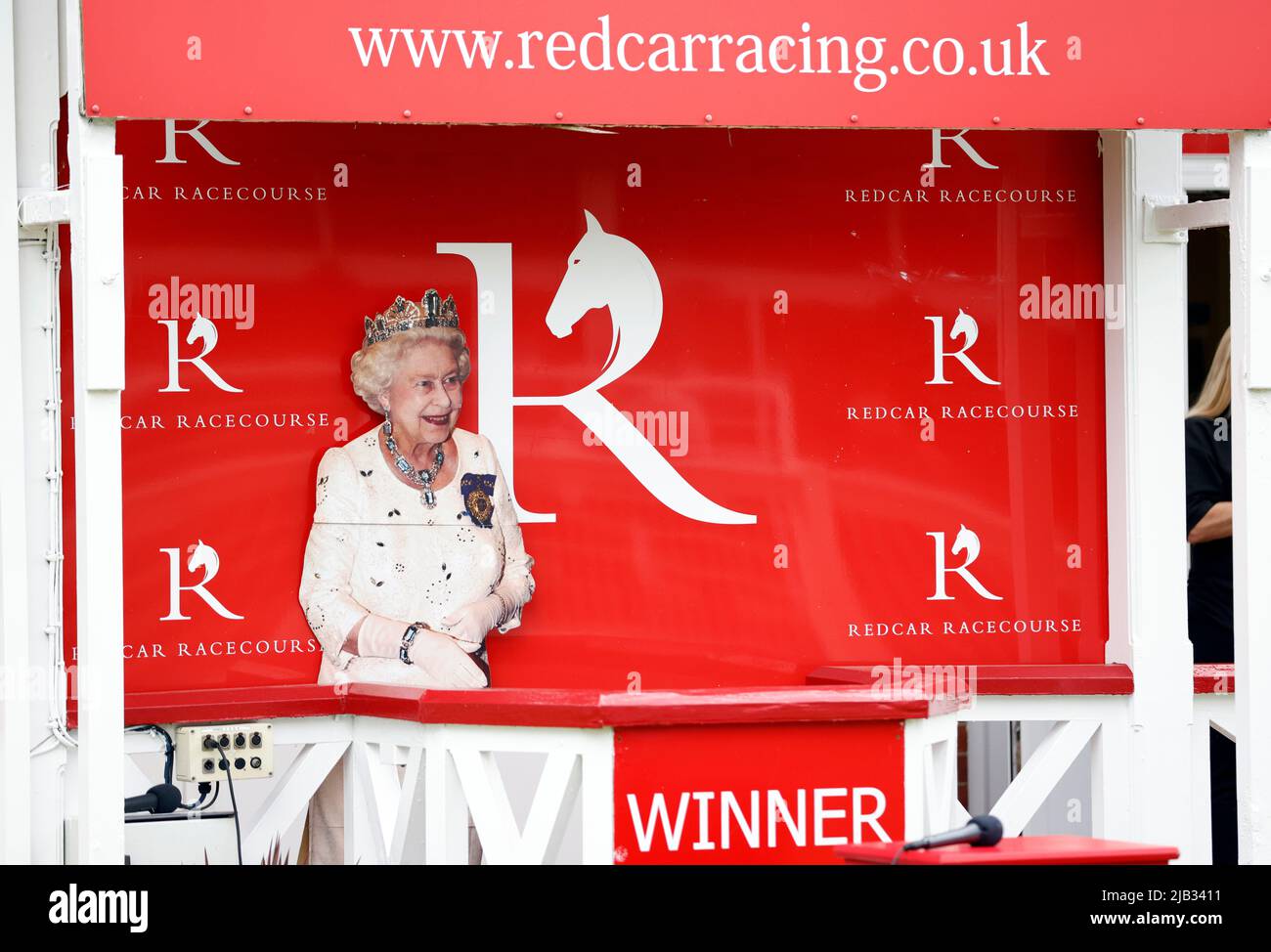 A cardboard cutout of Queen Elizabeth on the podium at Redcar