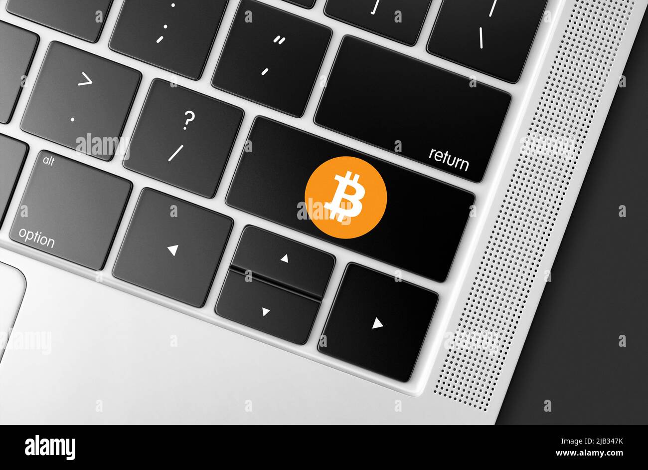 Dedicated Bitcoin cryptocurrency key on computer keyboard, concept picture of moden investment and global blockchain technology Stock Photo