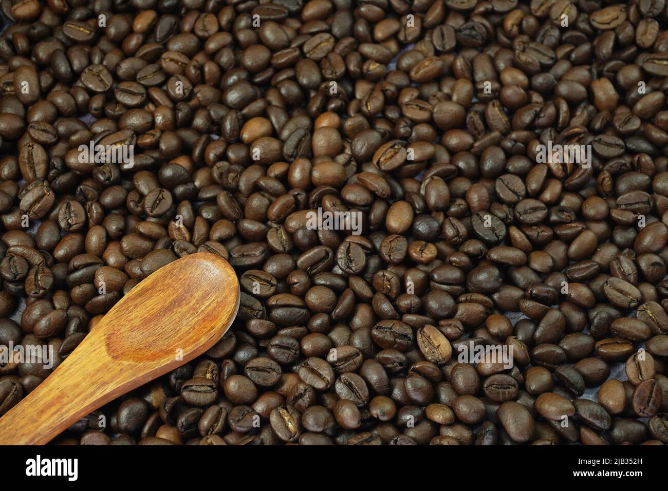 Roasted coffee beans in a background Stock Photo - Alamy