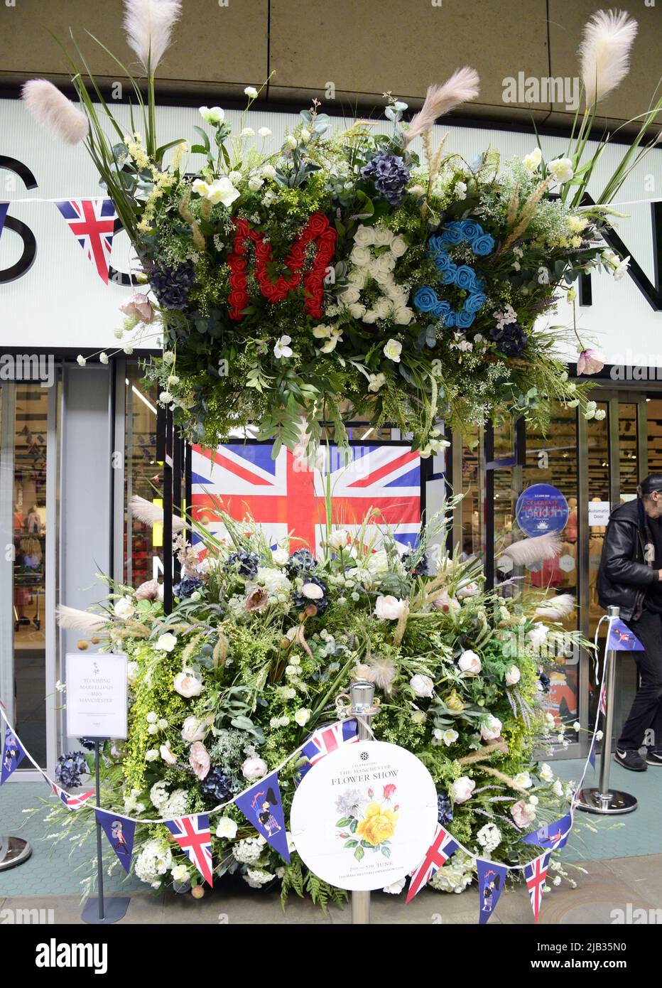 Manchester, UK, 2nd June, 2022. Flower display in front of Marks and