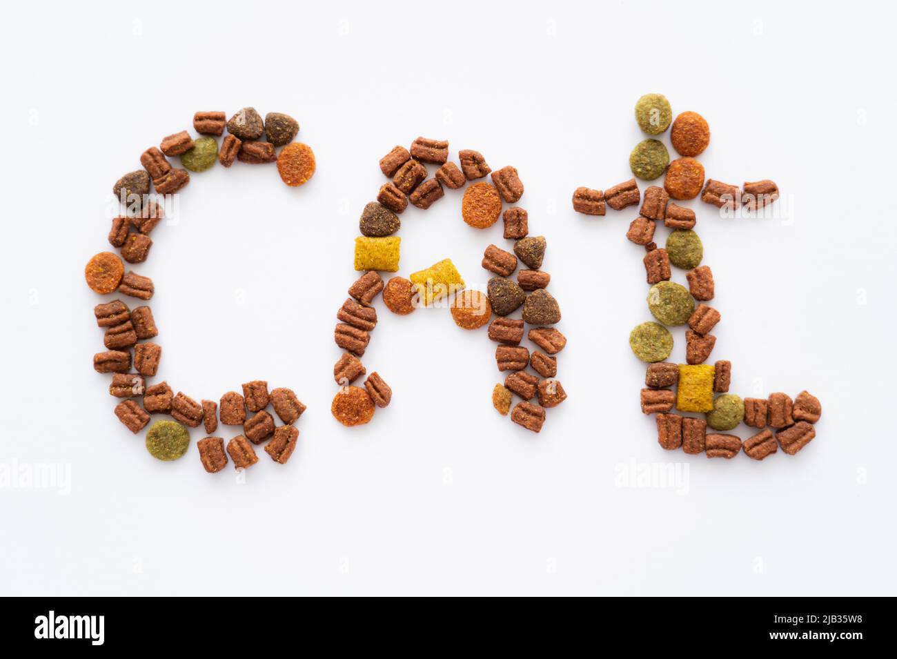 top view of cat word made of dry pet food isolated on white Stock Photo