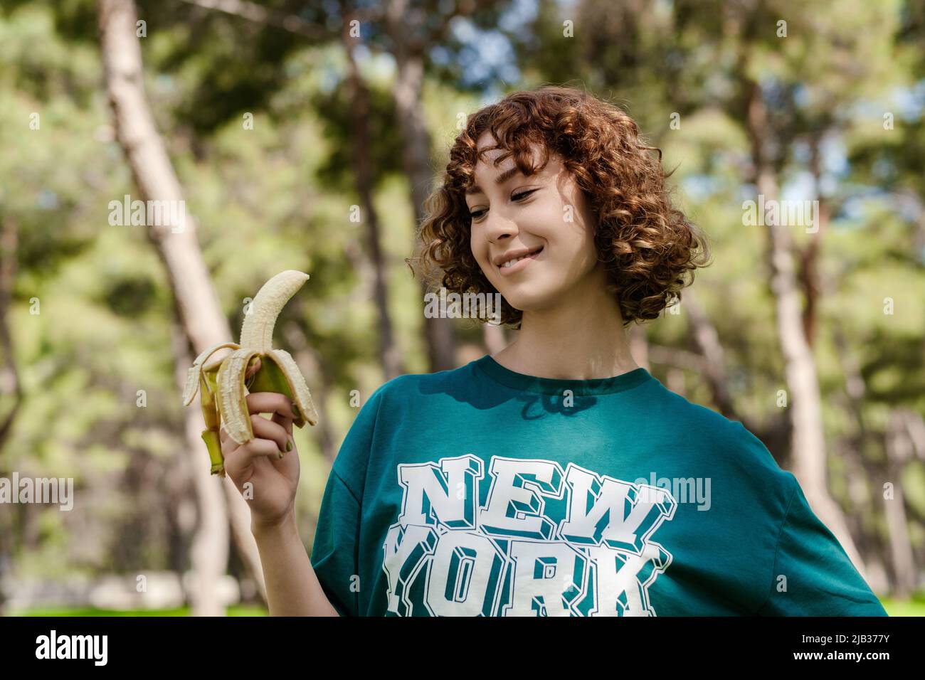 Young athlete eating fruit at sport hi-res stock photography and images ...