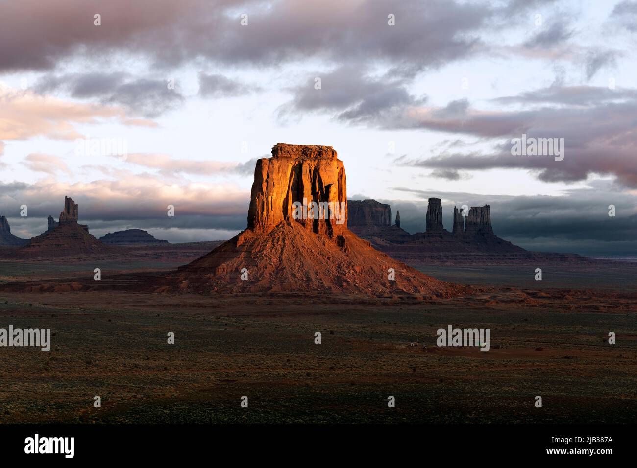 AZ00441-00....ARIZONA - Sunrise from Navajo Code Talker Outpost in Monument Valley Navajo Tribal Park. Stock Photo