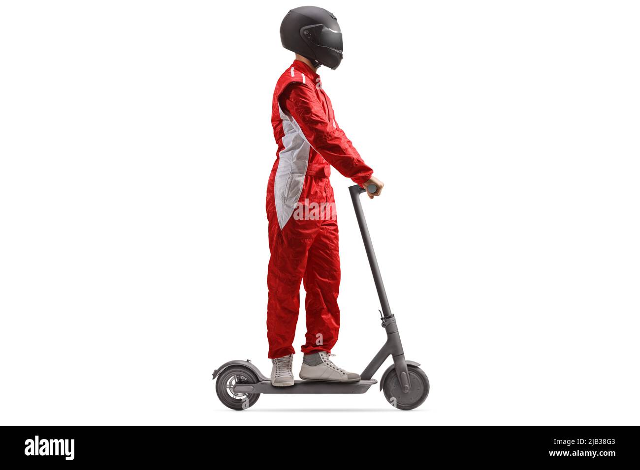 Full length profile shot of a racer in a red suit with a helmet riding an electric scooter isolated on white background Stock Photo