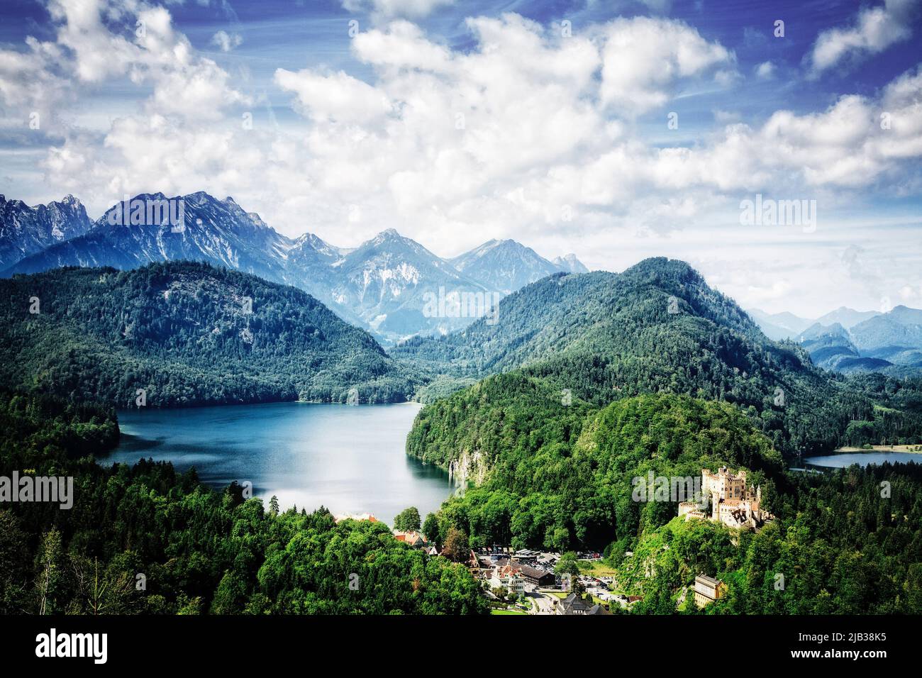 Hohenschwangau Castle stands at the foot of the Bavarian Alps overlooking the Alpsee bei Schwangau in southern Germany. Stock Photo