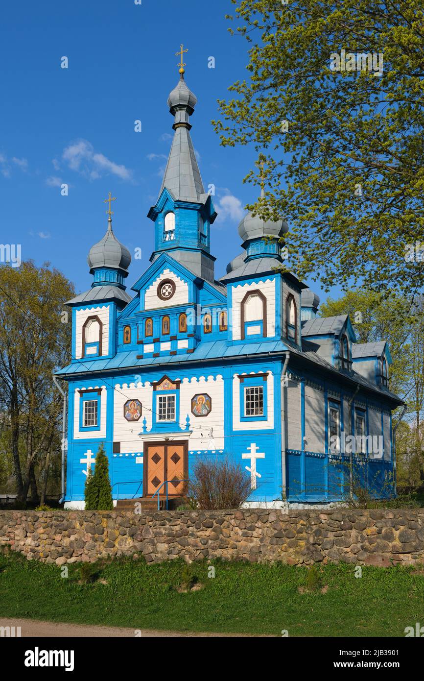 Old ancient wooden church of the Holy Life Giving Trinity in springtime. Telyadovichi village, Kopyl district, Minsk region, Belarus. Stock Photo