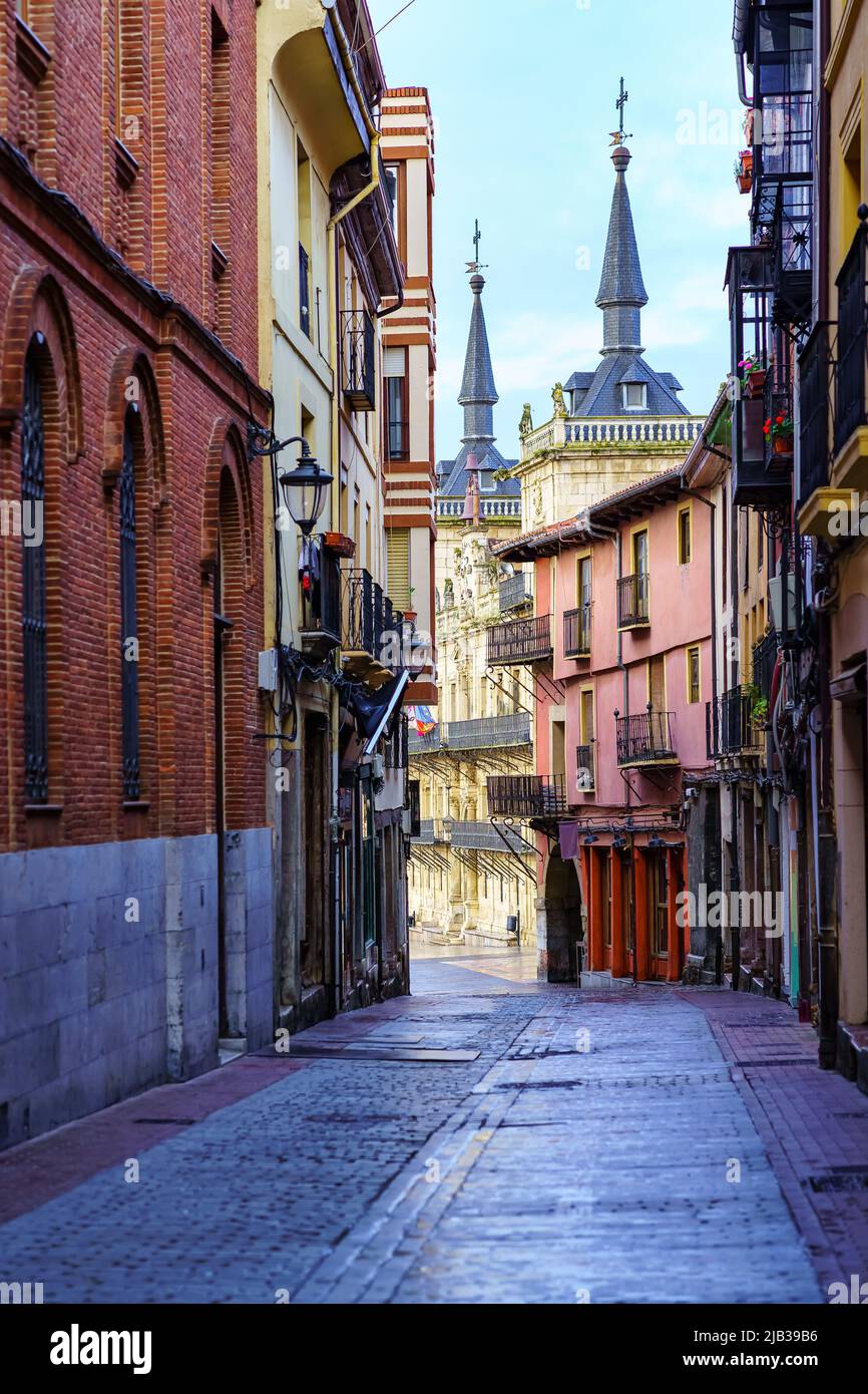 Narrow alley with old buildings and Leon town hall in the background, Spain. Stock Photo