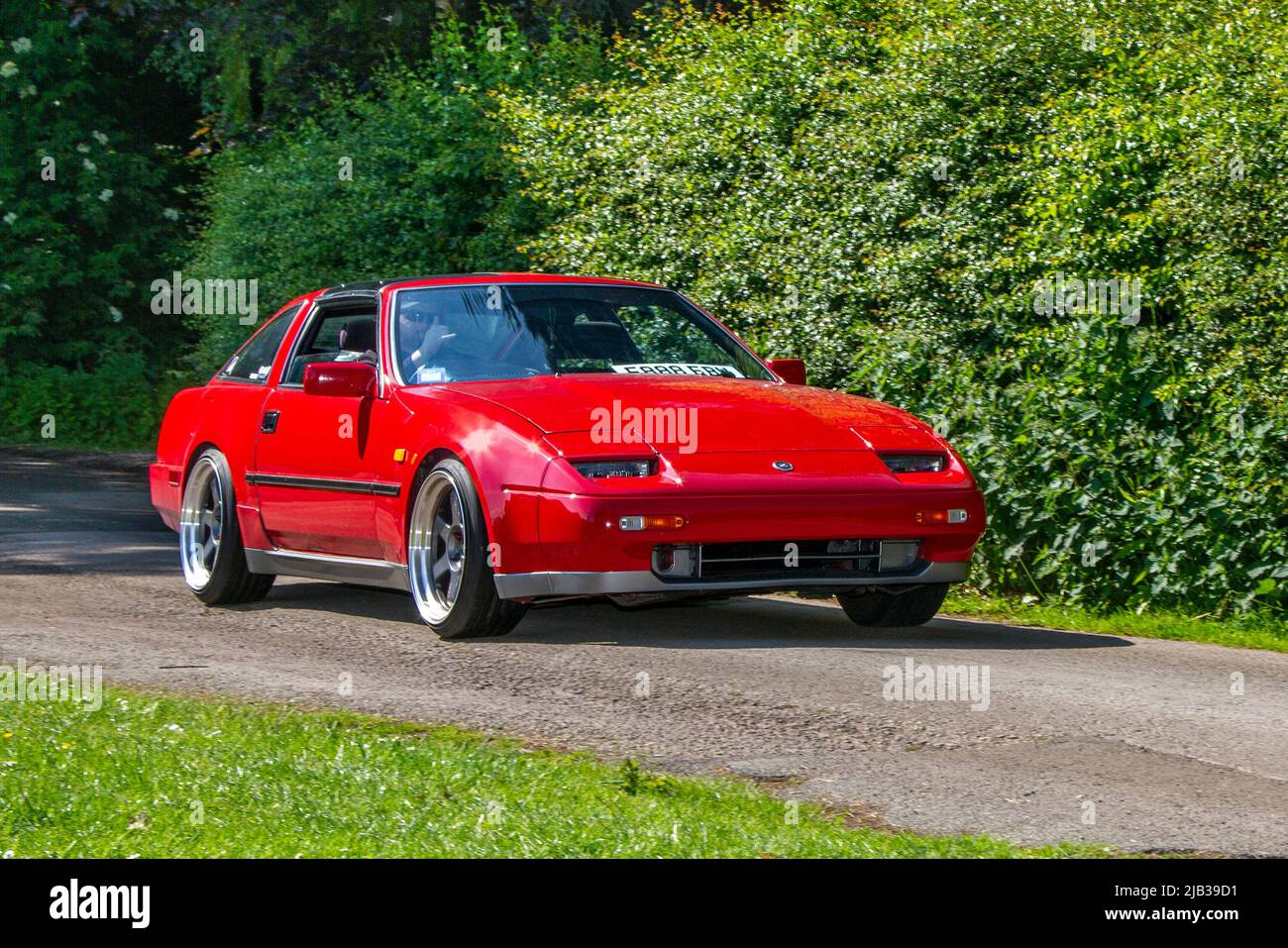 1988 80s eighties red Nissan 300 ZX 300ZX 2960cc 5 speed manual 2dr coupe, arriving in Worden Park Motor Village for the Leyland Festival, UK Stock Photo