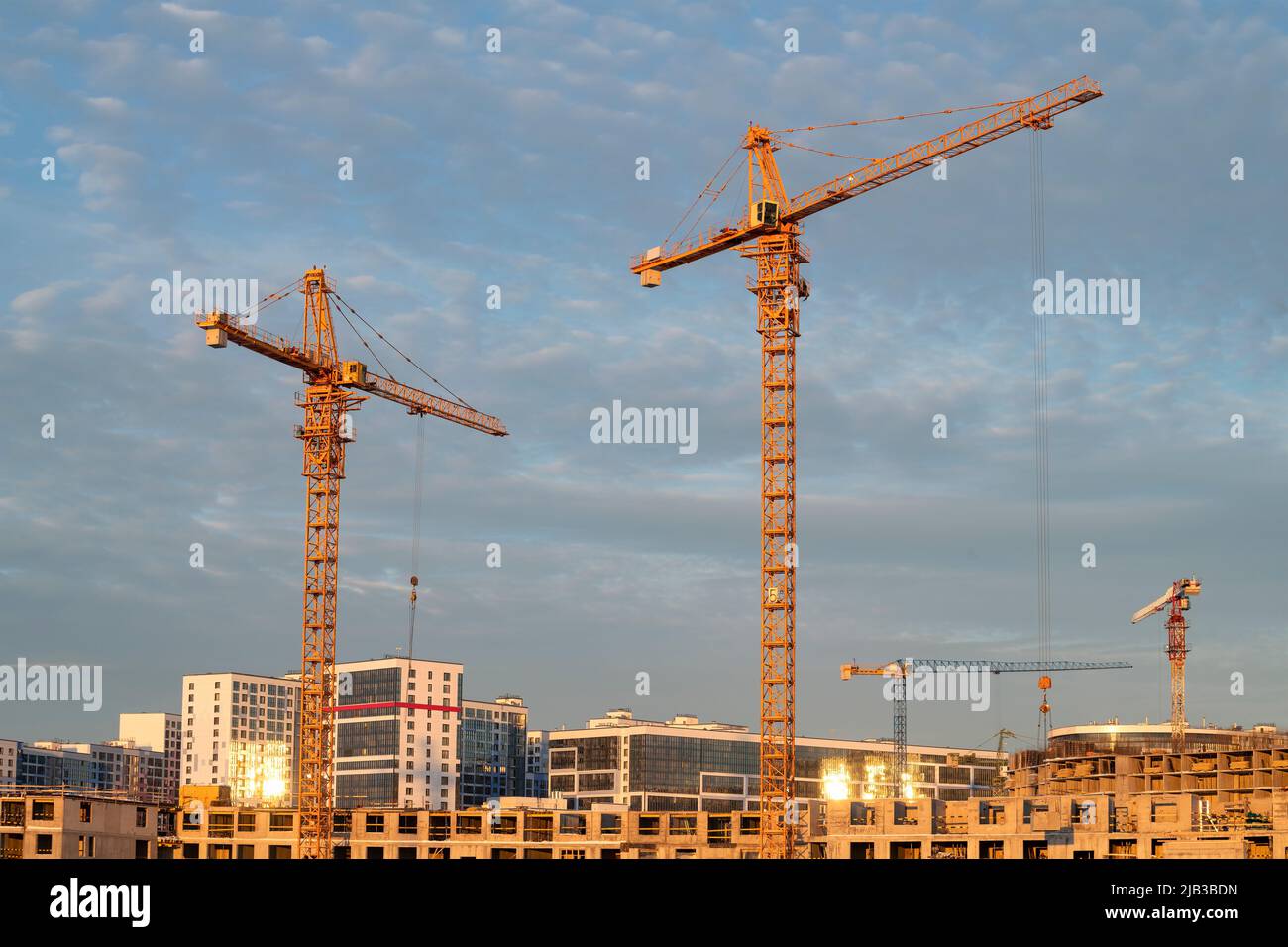 Cranes on the construction site of a new house. Saint Petersburg Stock Photo