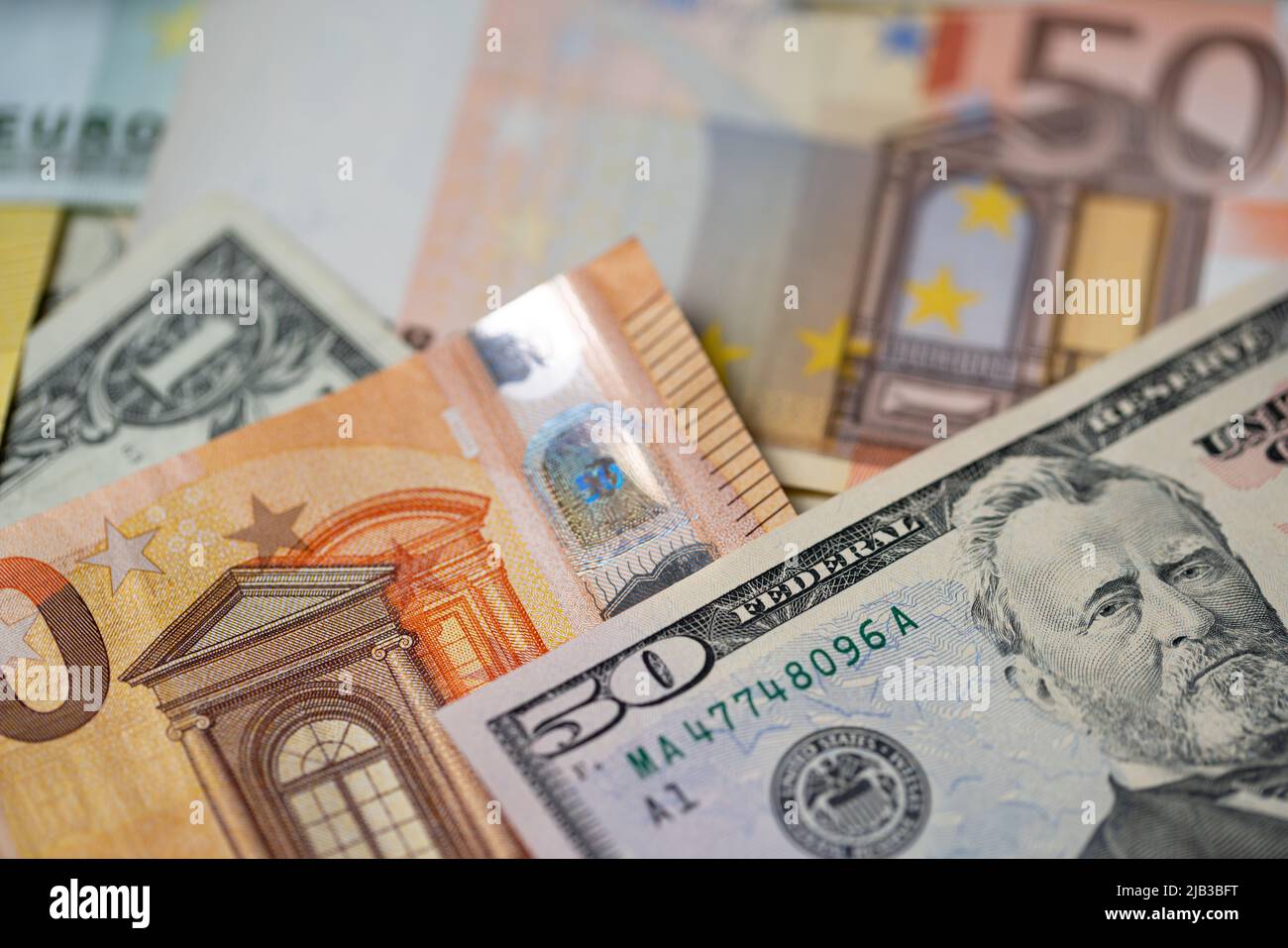 Fifty euro and dollar banknotes, european with american money system concept. Trade between EU and USA. Stock Photo