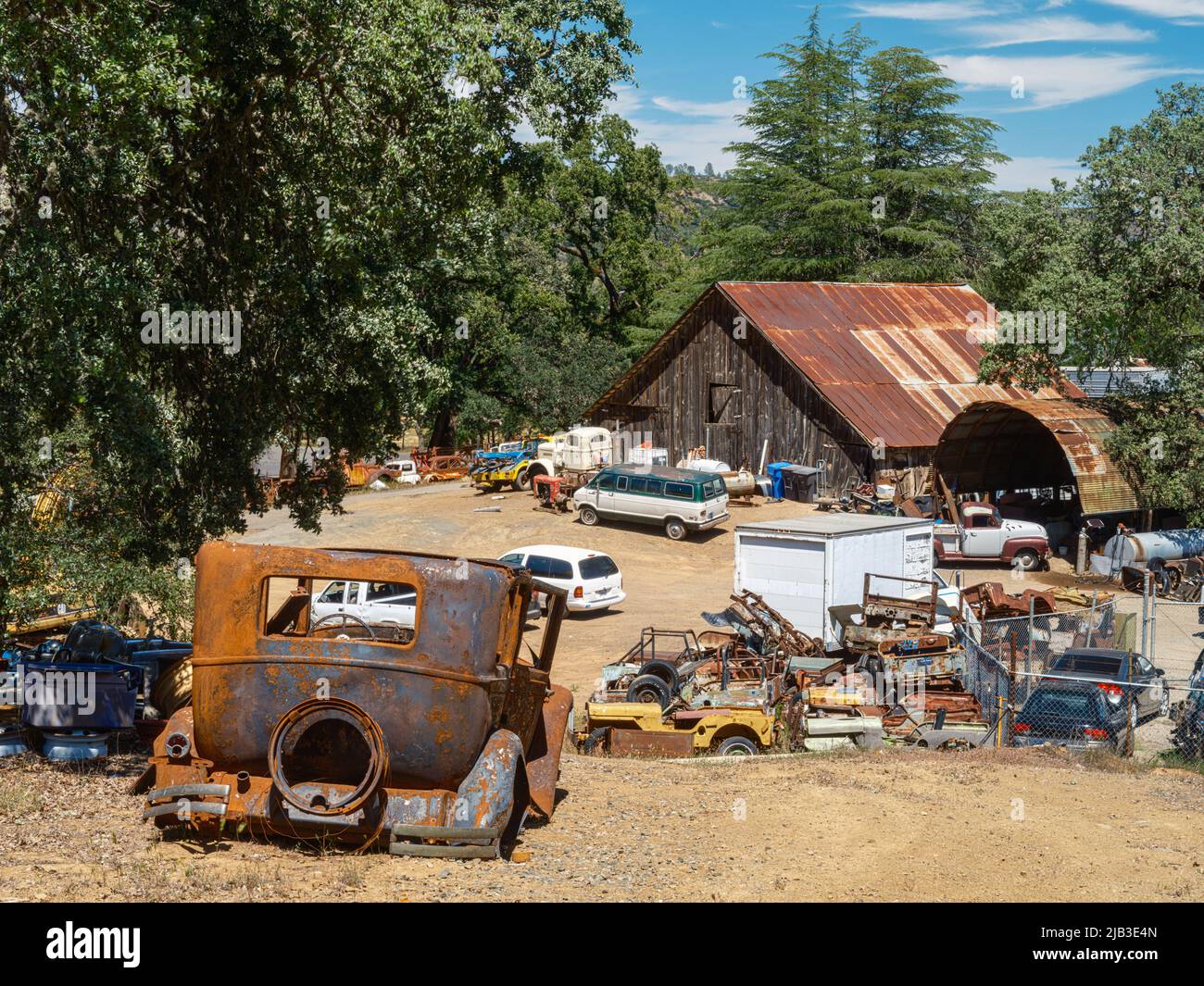 An old delapidated Auto Junkyard in Pope Valley, California Stock Photo