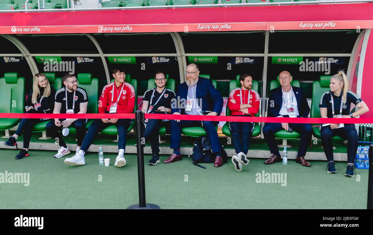 WROCŁAW, POLAND - 01 JUNE 2022: Wales’ Commercial Department Carys Price, Wales’ Team Operations Rhys Herbert, Wales' Rubin Colwill, Wales’ Media Officer Owain Harries, Wales’ Head of International Affairs Mark Evans, Wales' Joe Allen, Wales’ Media Officer Ian Gwyn Hughes and Siobhan Humphrey prior to the League A 2022 Nations League fixture between Poland & Wales at the Tarczynski Arena, Wrocław, Poland on the 1st of June, 2022. (Pic by John Smith/FAW) Stock Photo