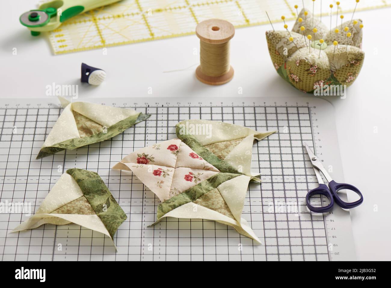 Patchwork block sewing process, pincushion, sewing and quilting accessories Stock Photo